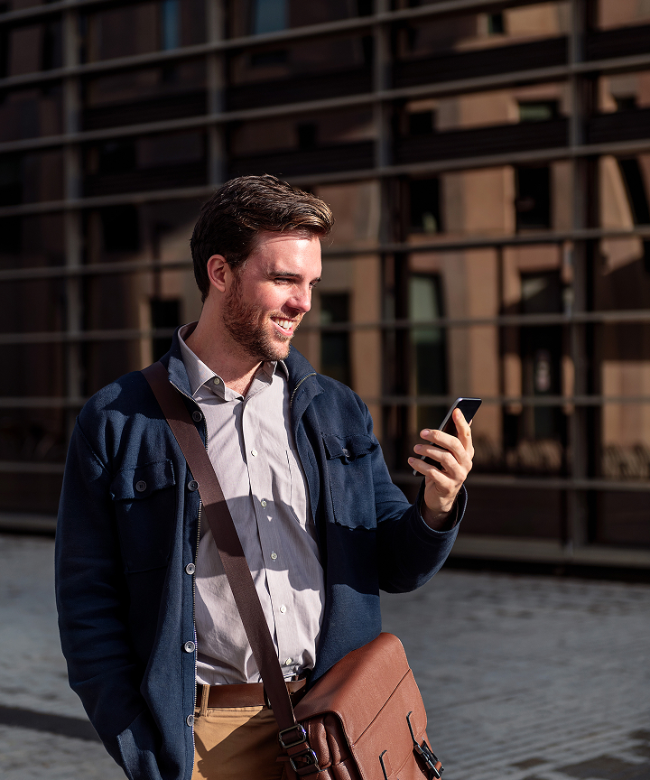 Person using smartphone to scan QR code